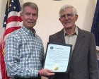 Manassas Mayor Harry Parrish and Dan Peacock with proclamation honoring Dick Peacock